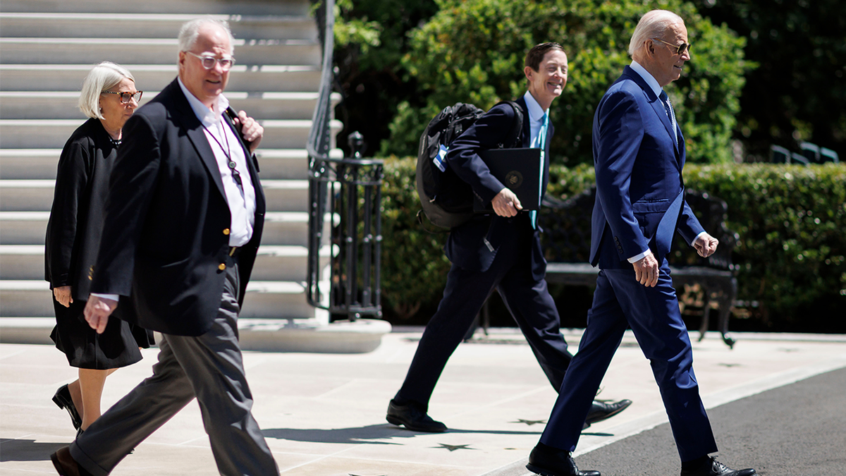 Biden walking with aides