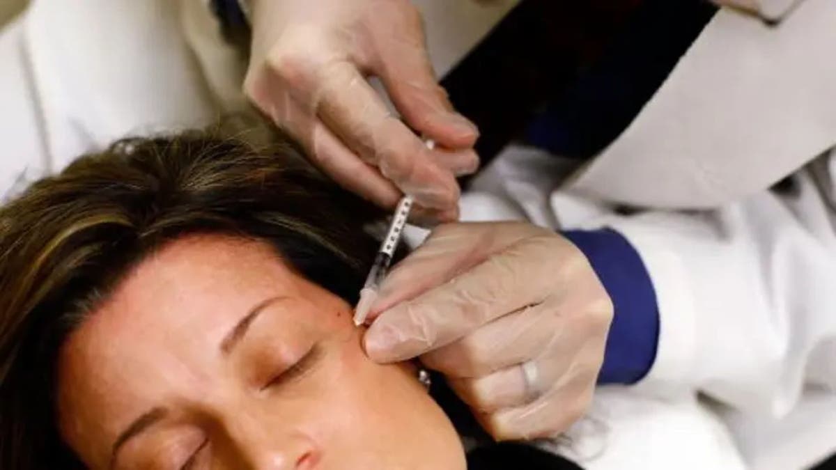 A woman receiving an injection