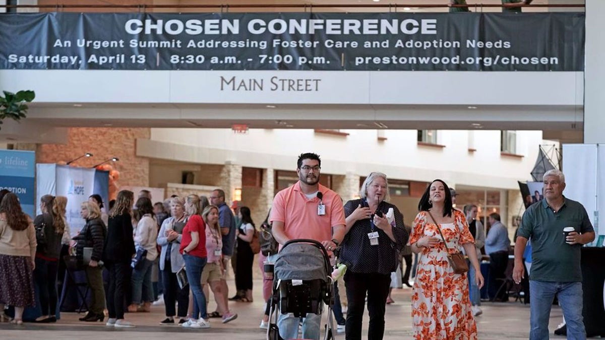 Sign reference "CHOSEN CONFERENCE" and attendees of nan conference