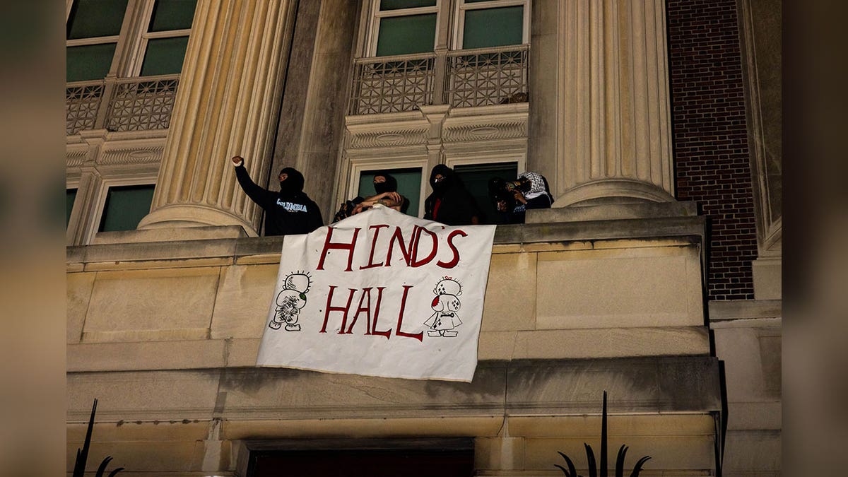 sign displaying "hinds hall" hangs extracurricular building during columbia assemblage takeover