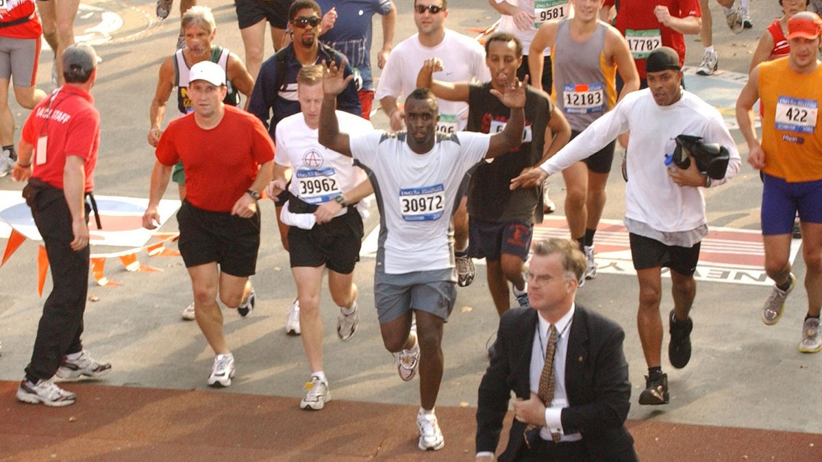Rapper Sean Combs runs across finish line of New York marathon