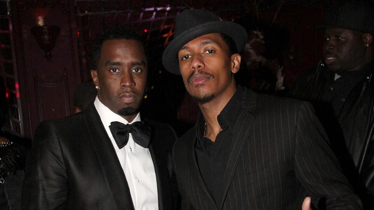 Nick Cannon and Diddy wear black suits to a party