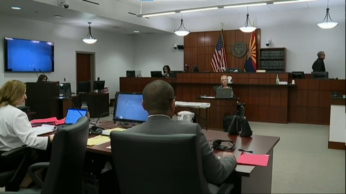 Judge Thomas Fink (right) walks out of the court room during proceedings in the trial of rancher George Kelly.