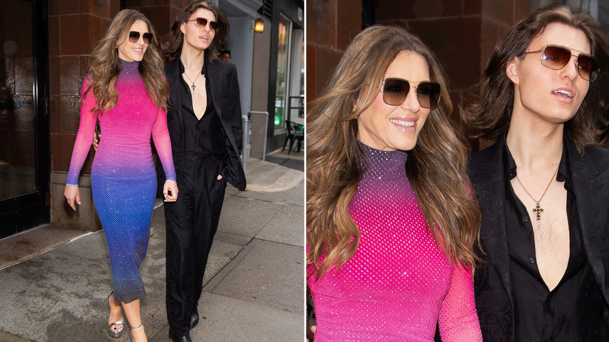 Elizabeth Hurley in a pink and blue hombre dress with her son in a black suit