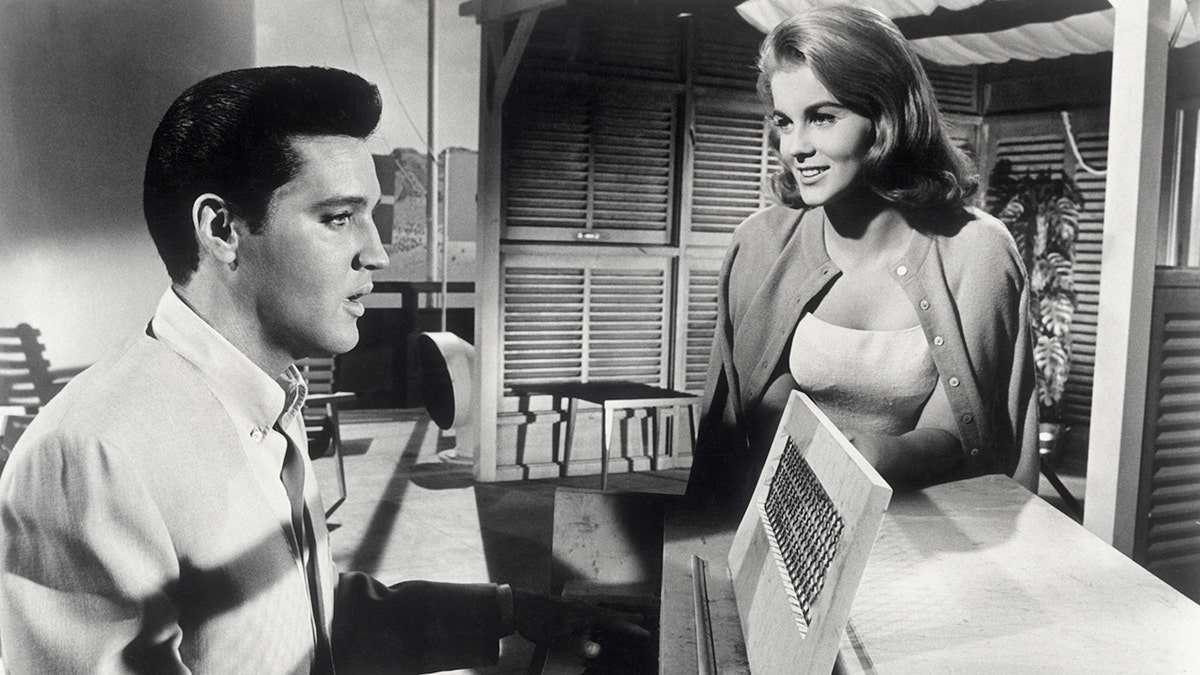 Elvis Presley and Ann-Margaret standing around the piano in "Viva Las Vegas."