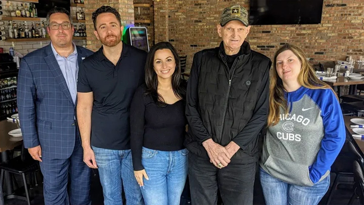 Vietnam Veteran Ernie Aimone poses with group