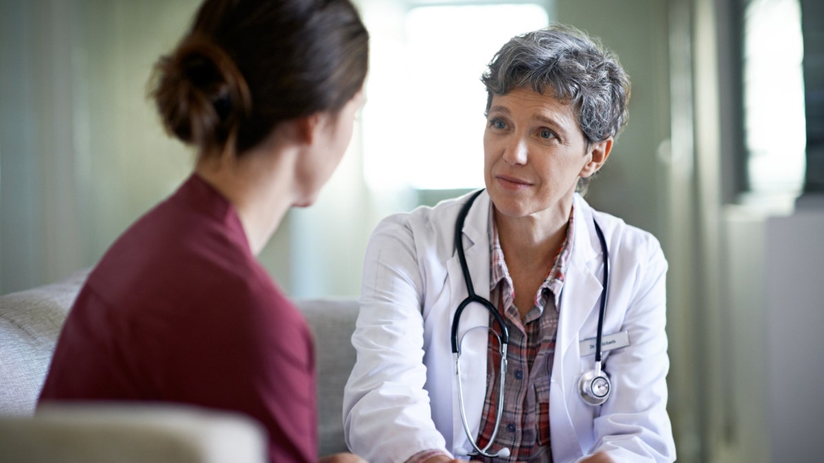 Female doctor with female patient