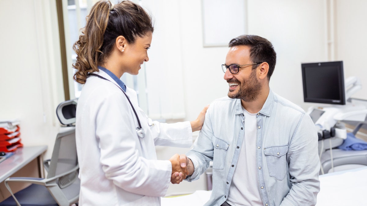 Female doctor with male patient