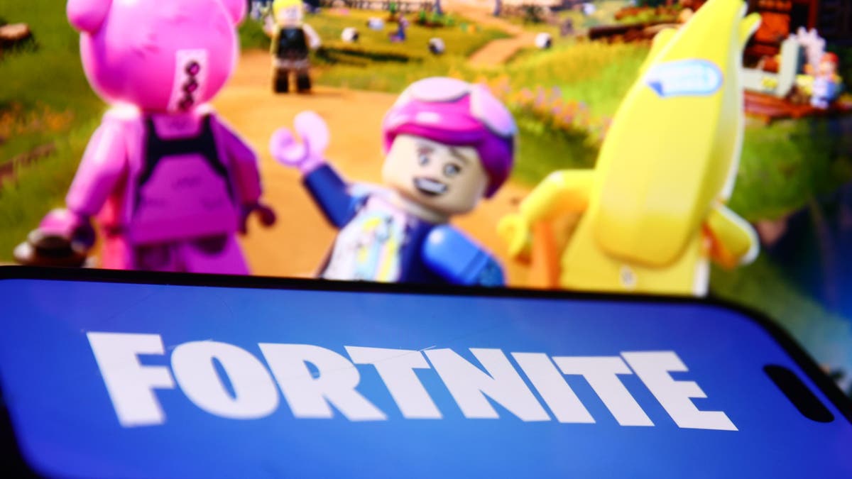 Lego Fortnite website displayed behind video game logo