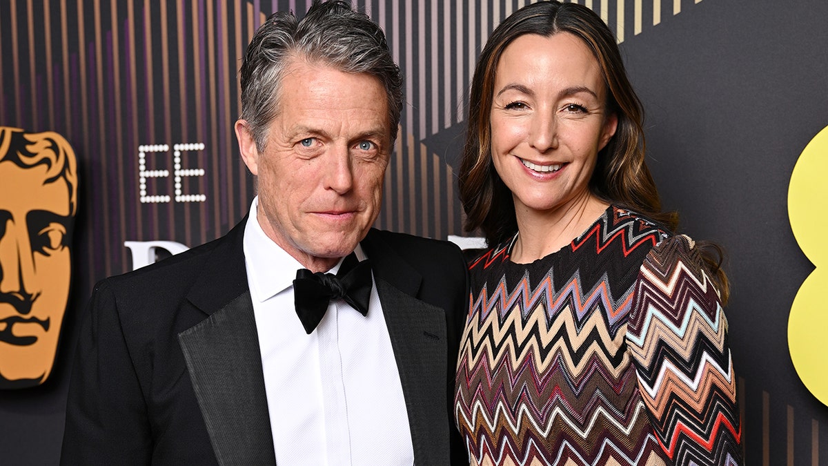 Hugh Grant and wife Anna Eberstein on the red carpet