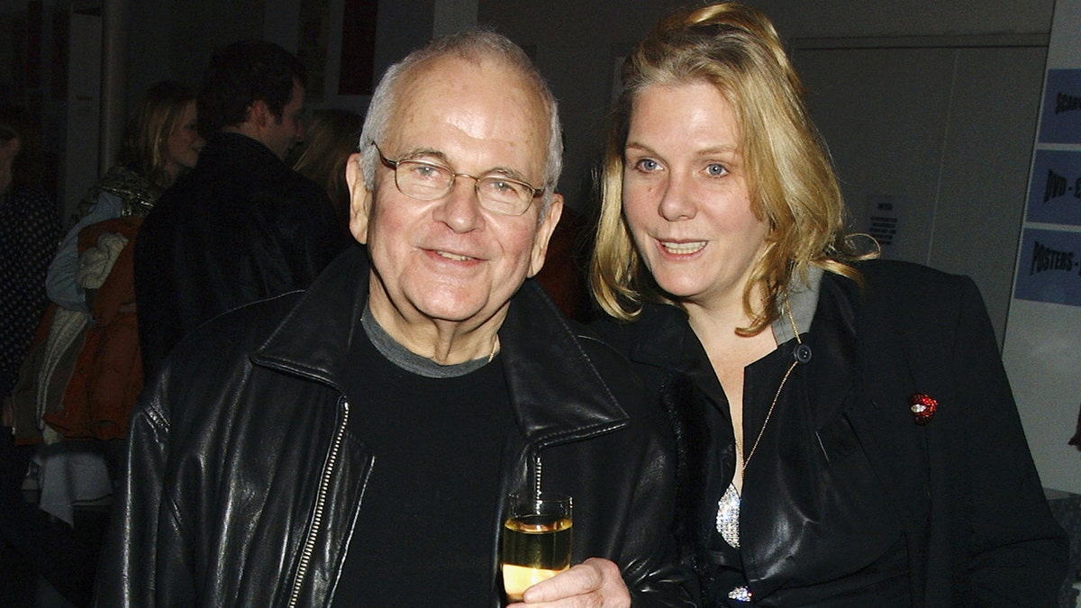Ian Holm and his wife Sophie de Stempel posing for a photo