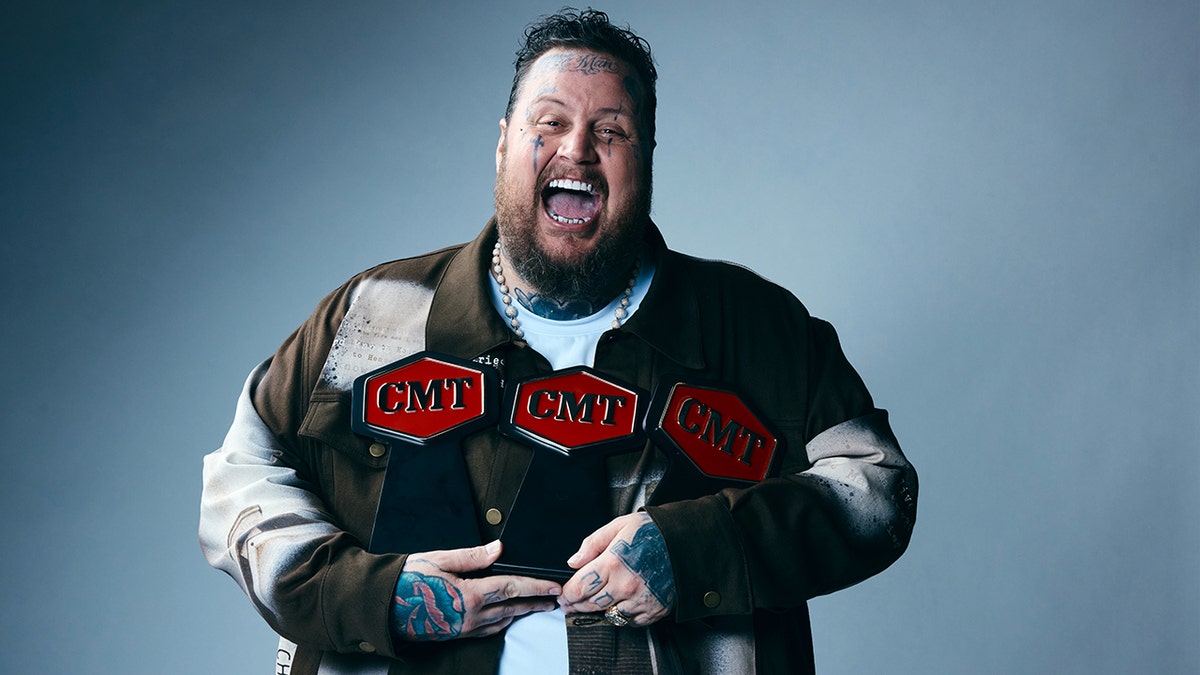 Jelly Roll holds his CMT Awards