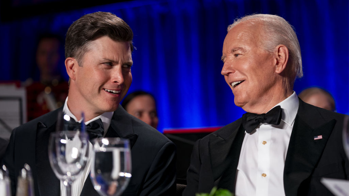 President Joe Biden speaks with comedian Colin Jost during the White House Correspondents' Association (WHCA) dinner in Washington, D.C.