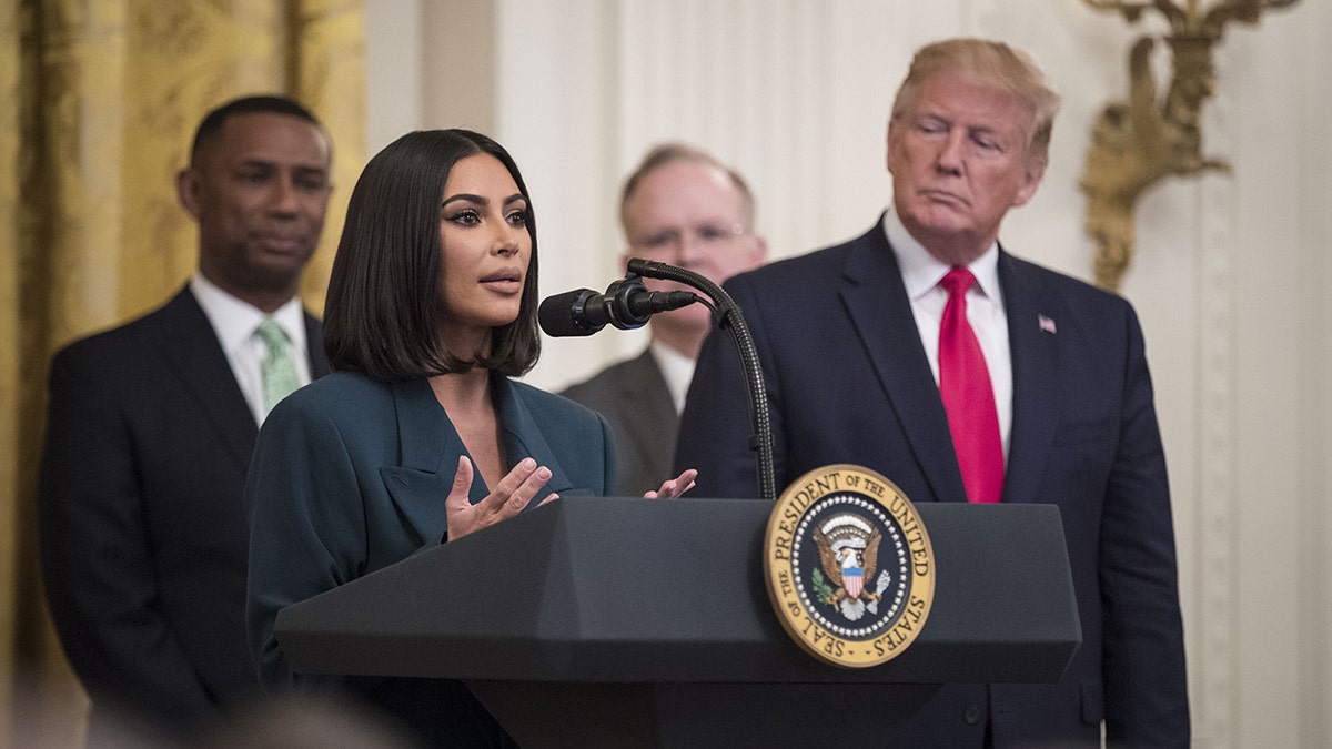 Kim Kardashian talks pinch her hands down nan podium astatine nan White House pinch erstwhile President Trump looking on