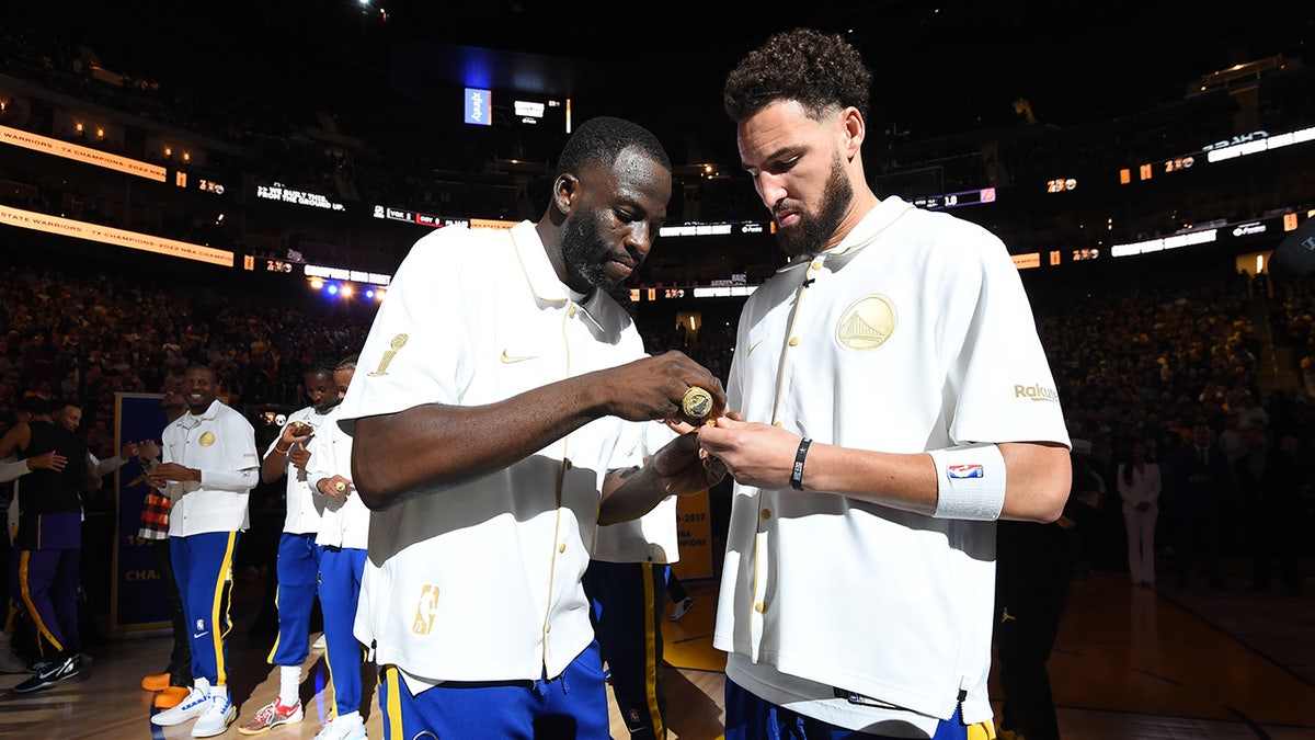 Klay and Draymond with rings