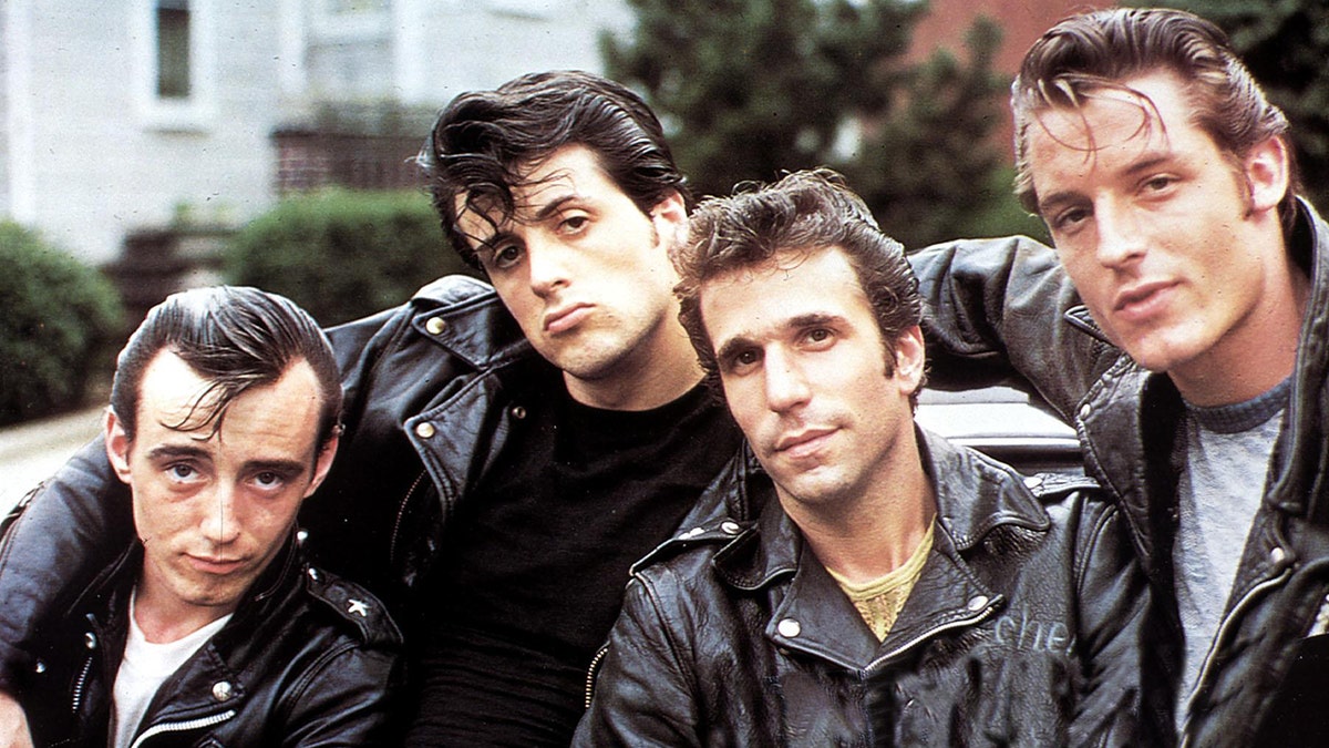 Henry Winkler, Sylvester Stallone and cast of "Lords of Flatbush" posing for a photo