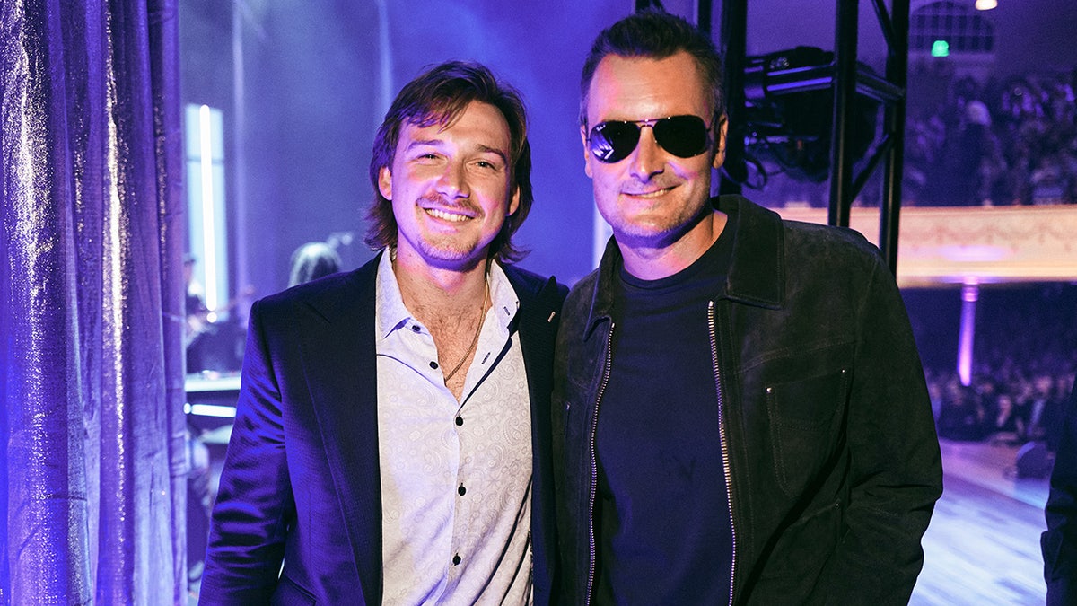 Country stars Morgan Wallen and Eric Church airs for photos aft a concert.