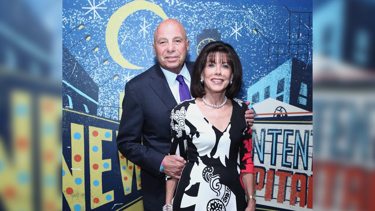 Richard Leibner and his wife pose on the red carpet.