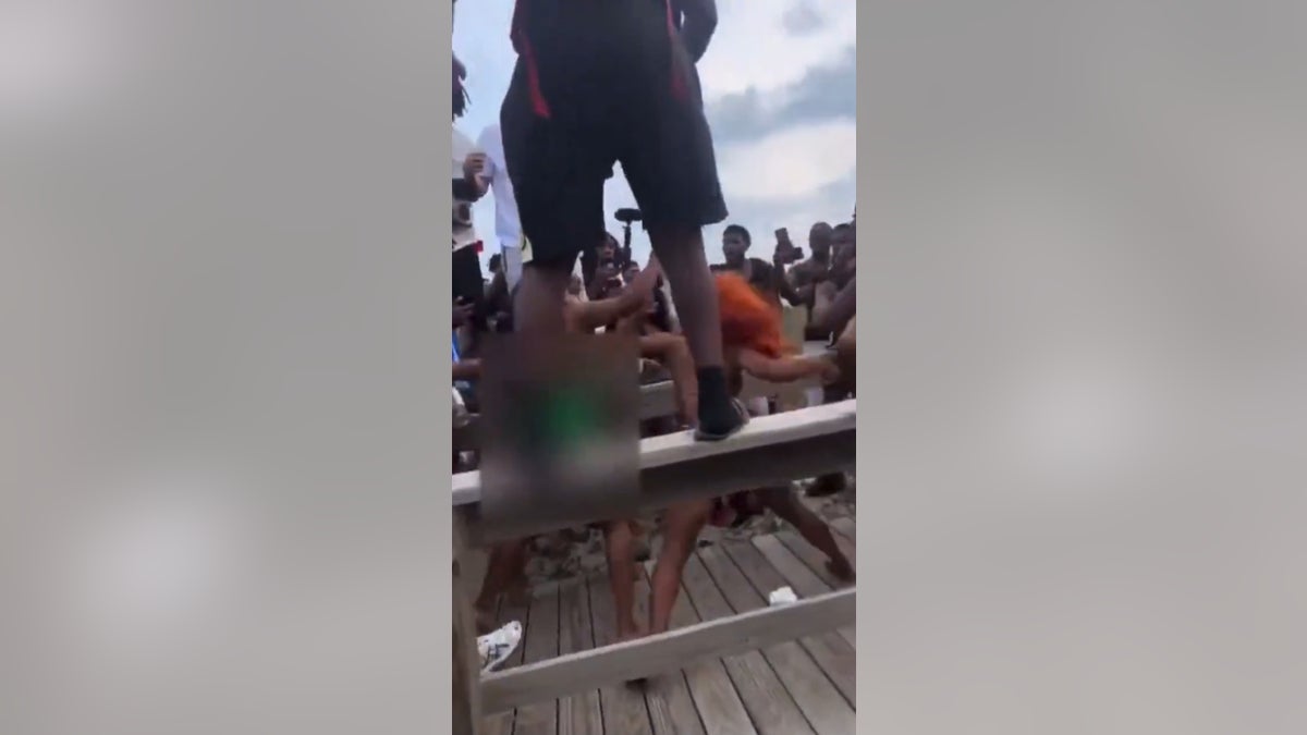 Two women throwing punches during a brawl during Orange Crush in Georgia.