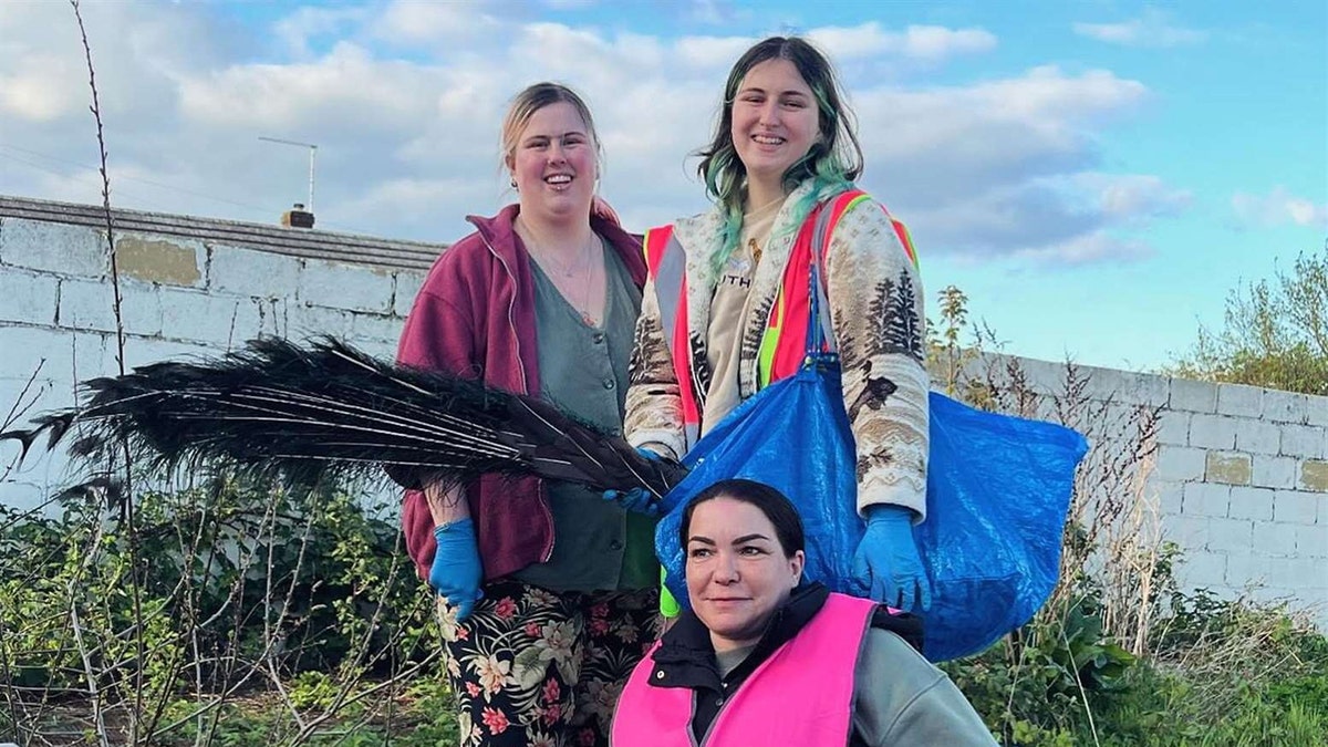peacock rescuers hold noisy peacock in IKEA bag SWNS