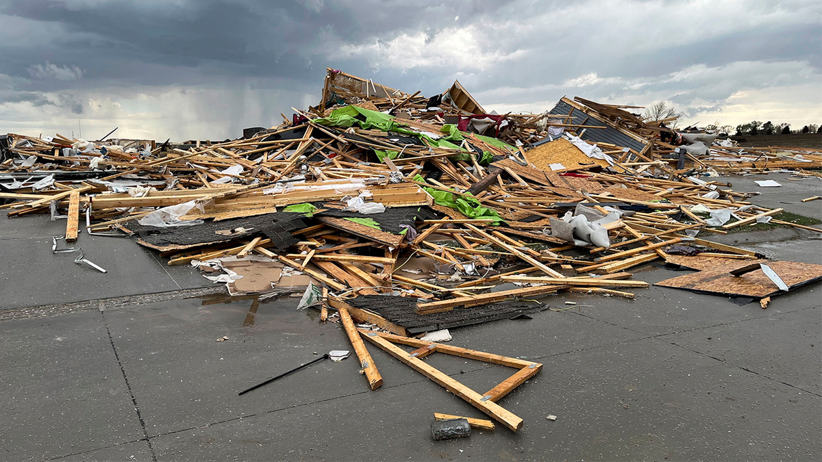 Debris is seen from a destroyed home