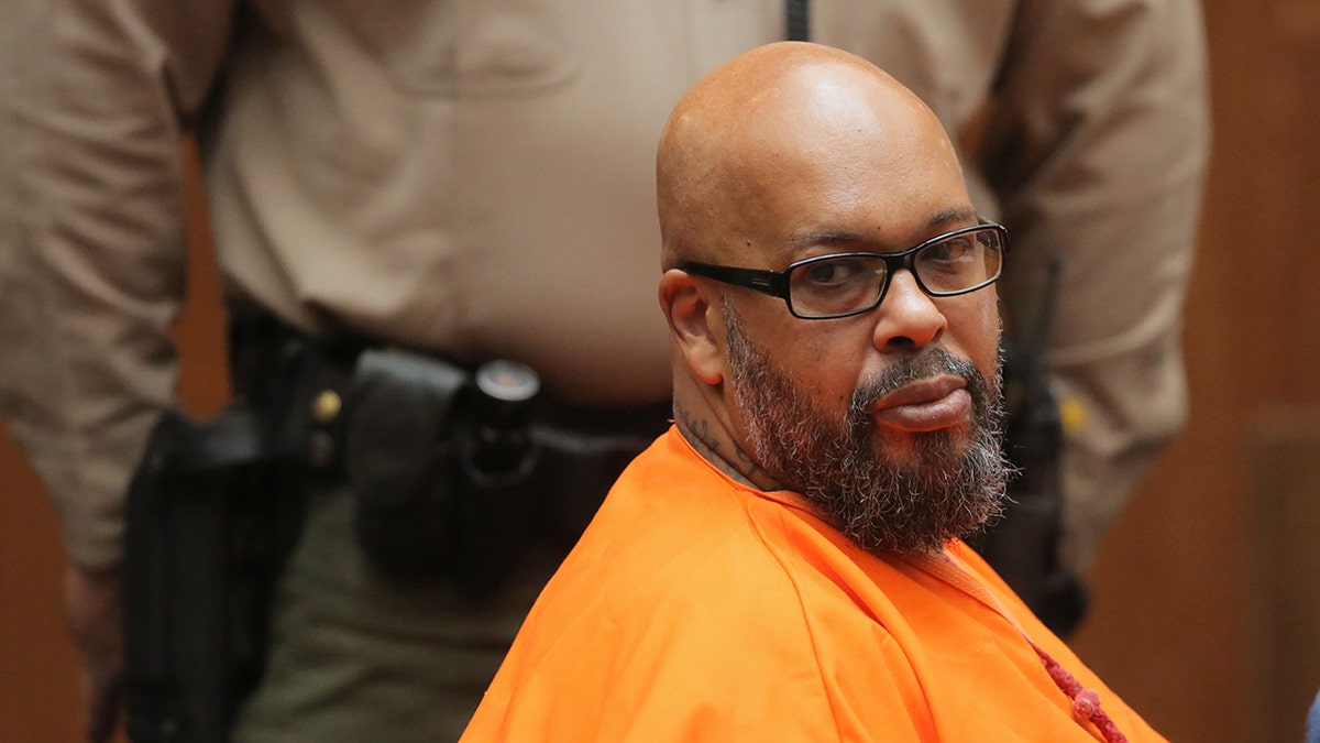 Former music executive Suge Knight wears orange prison jumpsuit in court.