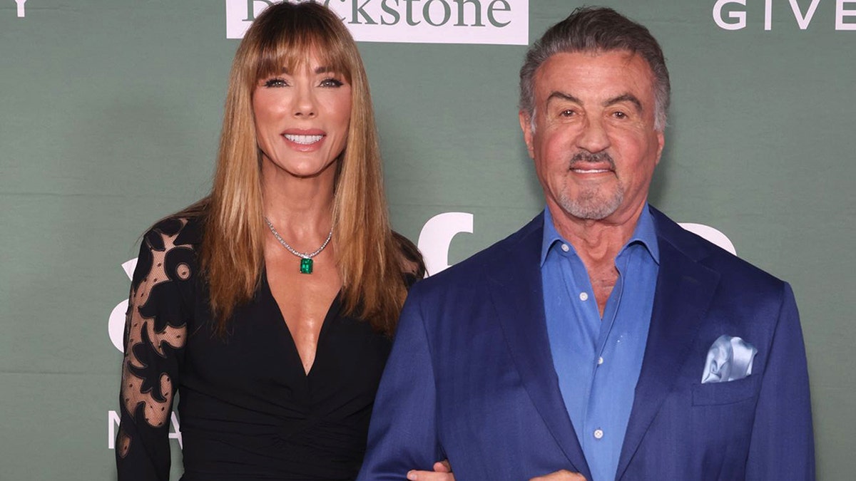 Jennifer Flavin and Sylvester Stallone on the red carpet in Florida.