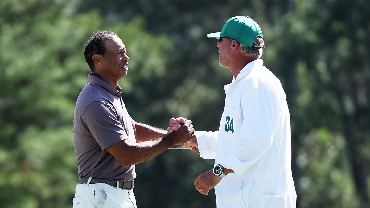 Tiger Woods with caddie