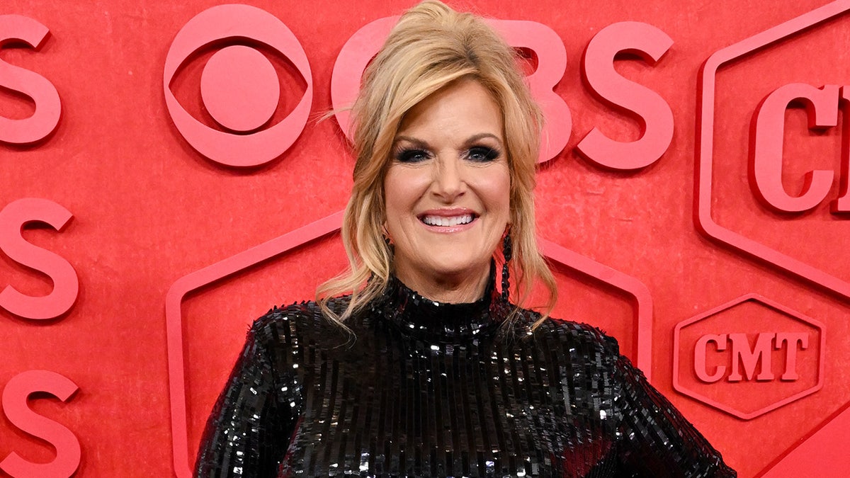 Country star Trisha Yearwood walks CMT Music Awards in black sequin dress