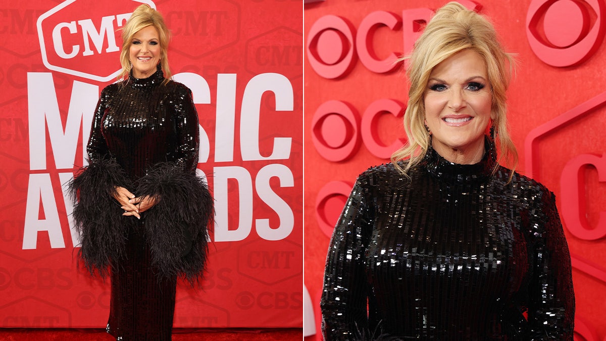 Trisha Yearwood in a black dress with feather accents
