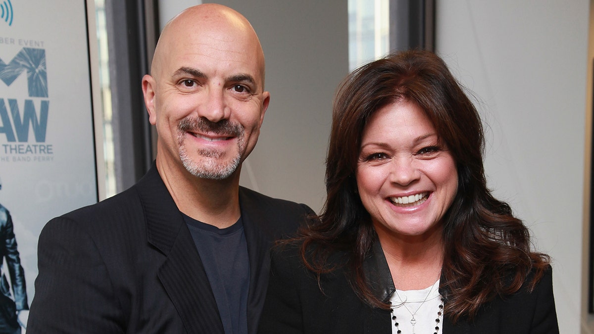 Valerie Bertinelli and Tom Vitale smiling for the camera
