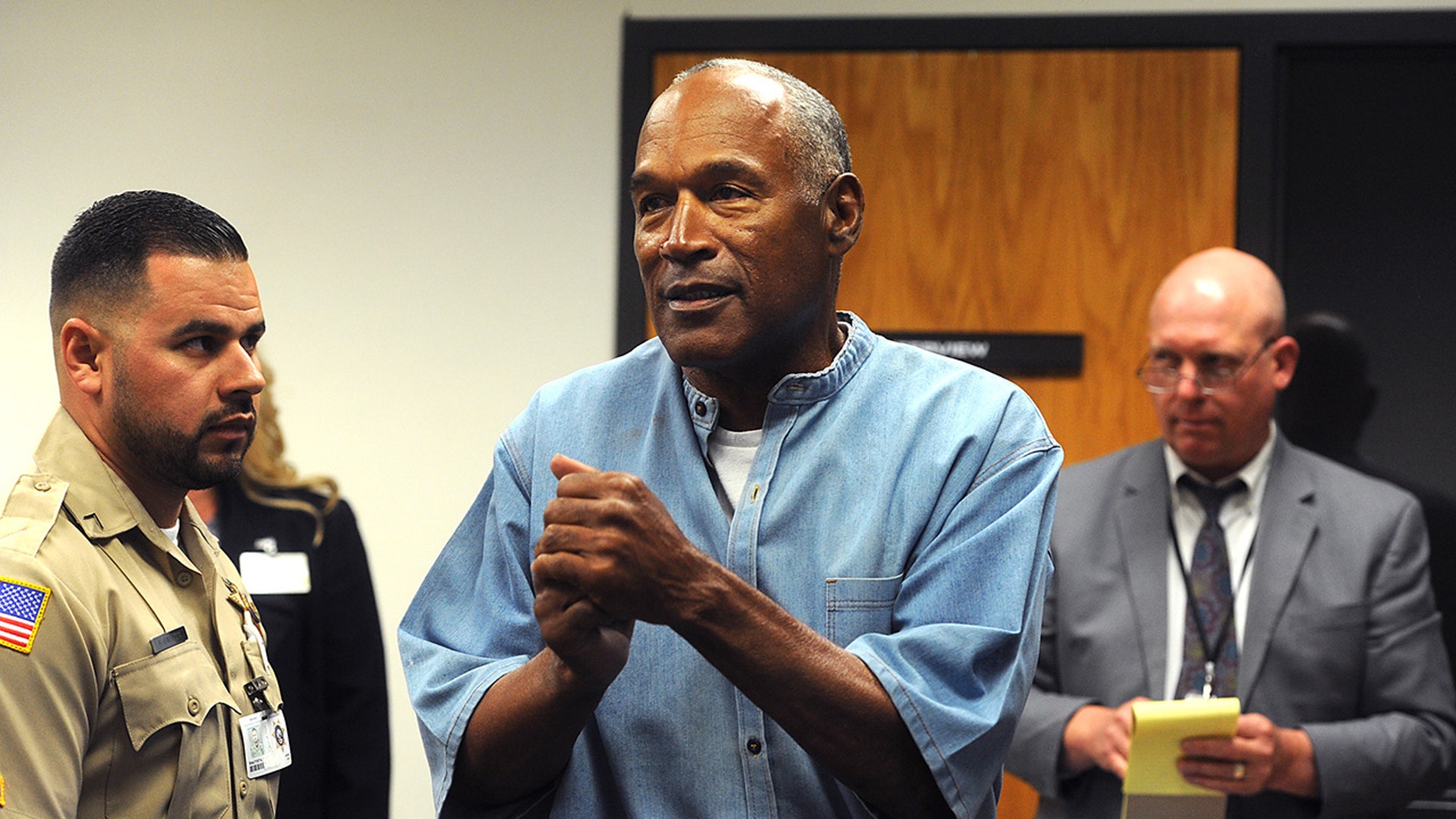 O.J. Simpson reacts after learning he was granted parole at Lovelock Correctional Center 