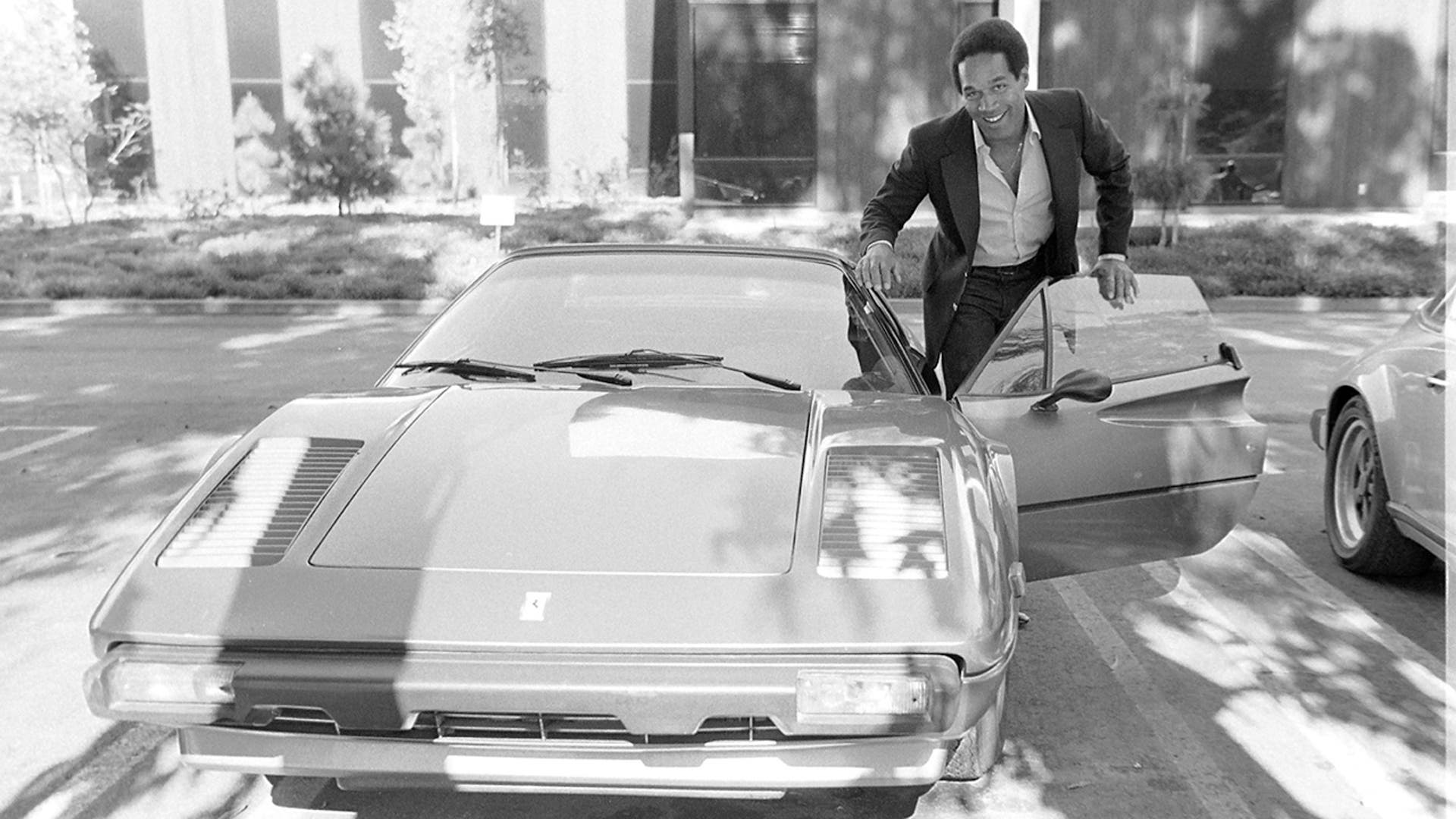 O.J. Simpson poses with his Ferrari