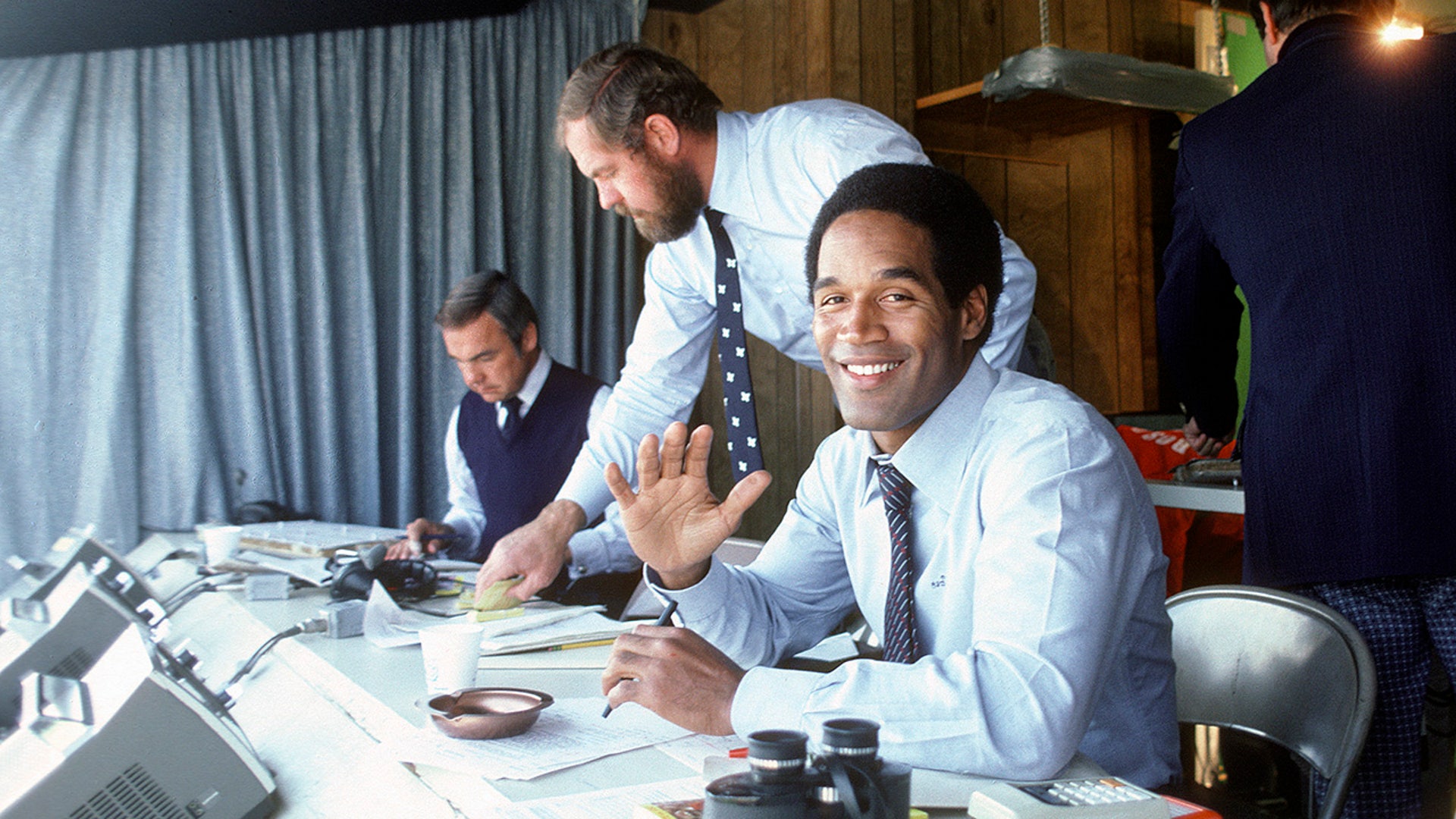 NBC Football Analyst O.J. Simpson in the both smiling for the camera