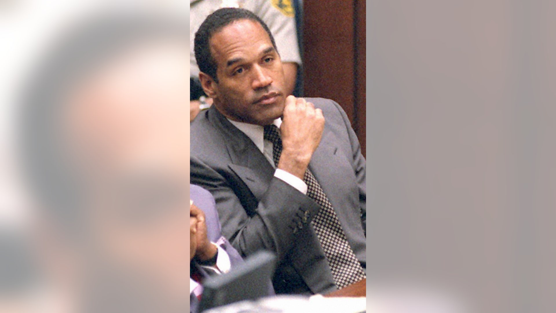 Former American football star and actor O.J. Simpson listens to testimony during his double murder trial in Los Angeles