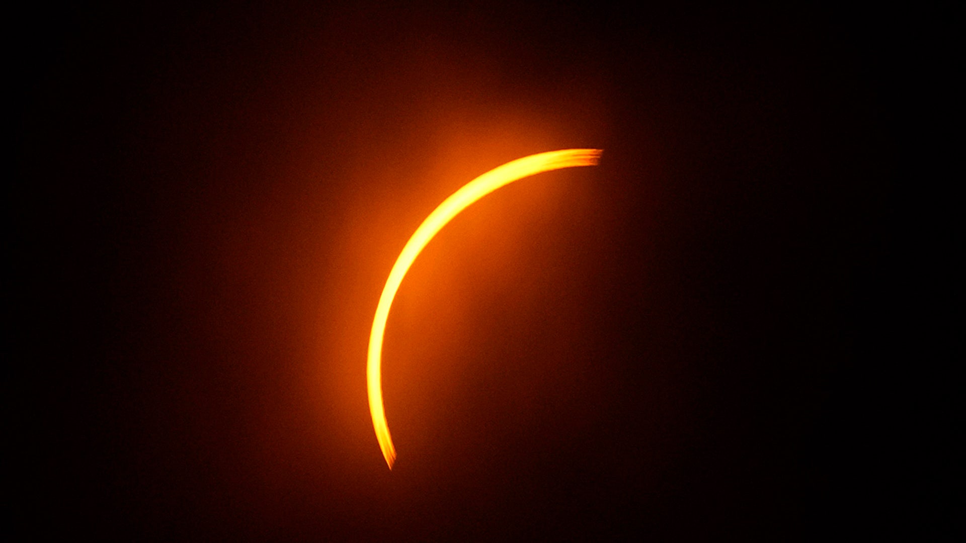 The moon partially covers the sun during a total solar eclipse in Eagle Pass