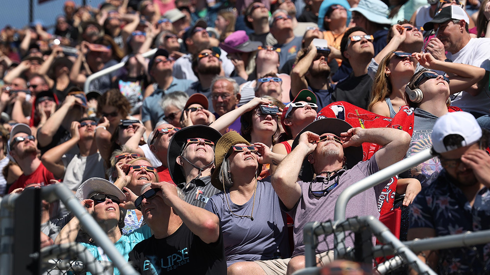 People view the start of the total eclipse on the campus of Southern Illinois University.