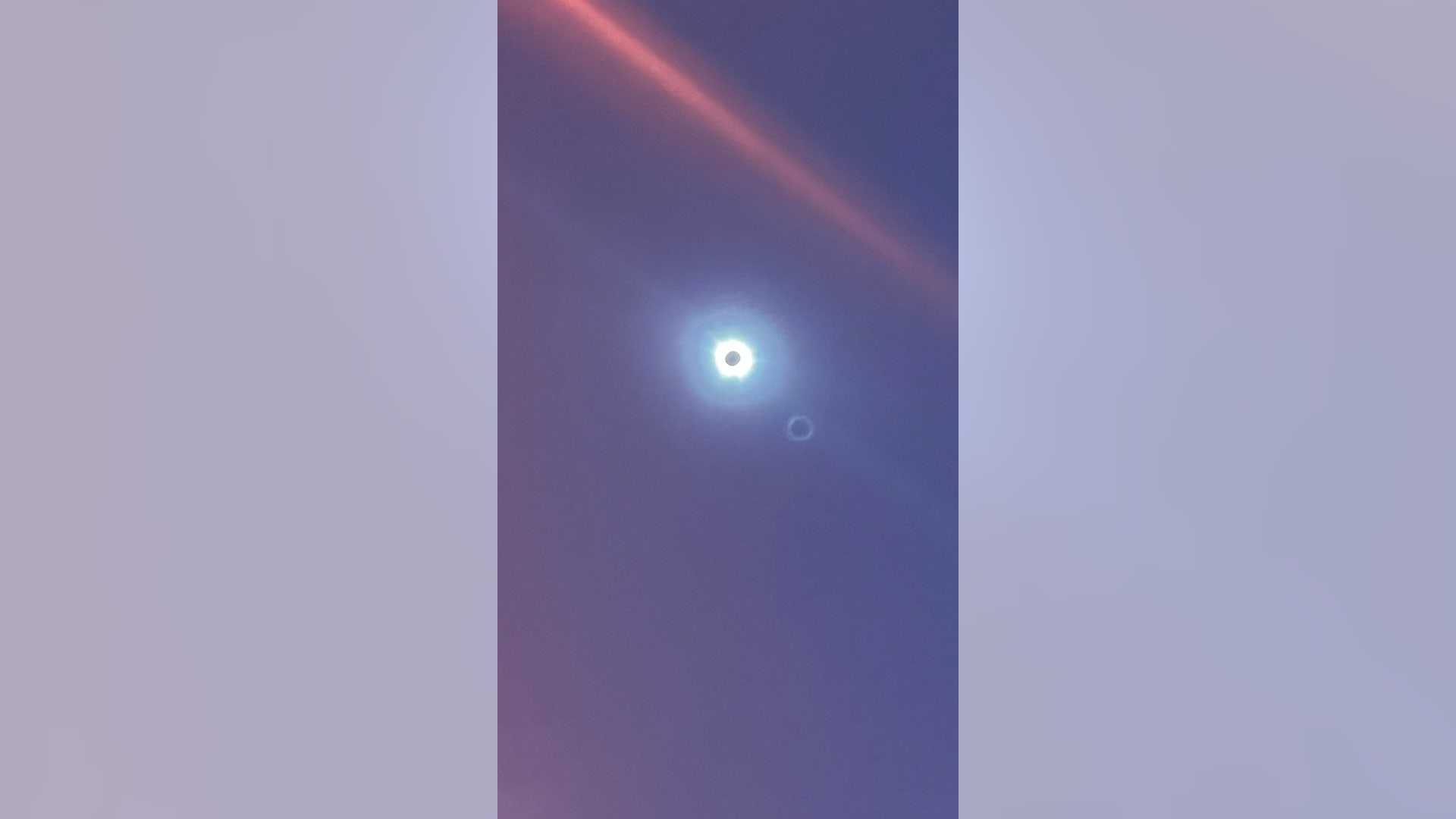 The solar eclipse is seen from downtown Dallas, Texas