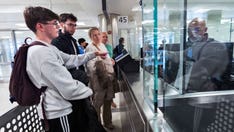 US airports adapt to travel surge by expanding use of technology to process passengers