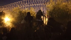 Caught on camera: Crowds of illegal immigrants cut razor wire, rush across border into Texas