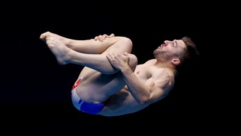Diver takes massive spill in front of French president during Olympics pool opening