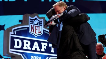 Titans draft pick JC Latham gives Roger Goodell bear hug on draft stage despite commish's recent back surgery