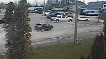 Chilling surveillance video shows moment Michigan driver plows into birthday party, killing two kids