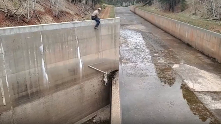 SEE IT: Colorado wildlife officers dangle rope to rescue mountain lions from spillway