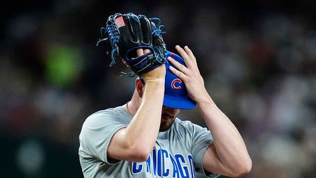 Cubs pitcher forced to change glove due to white in American flag patch