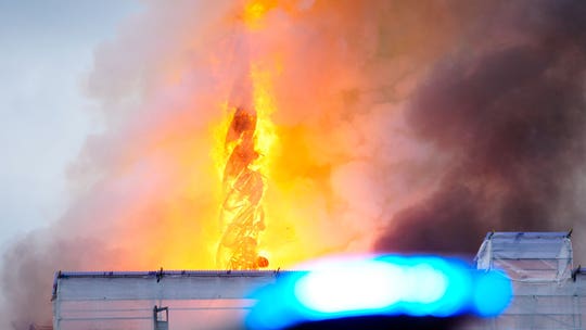 Iconic spire atop 17th-century Old Stock Exchange in Denmark collapses in fire