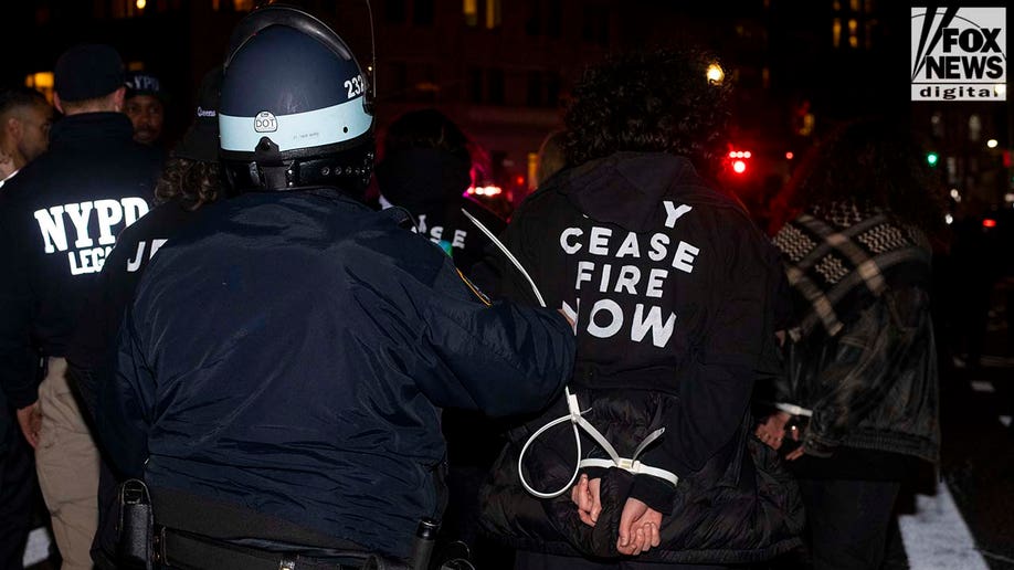 NYPD officer arrests protester