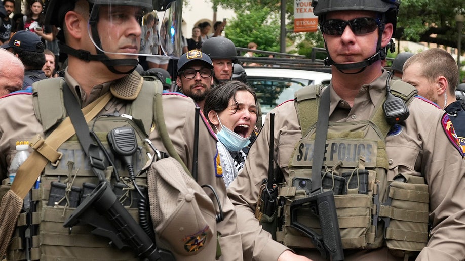 A woman is arrested at a pro-Palestinan protest