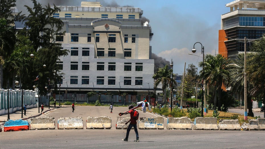 Haitian gangs loot national library amid spiraling violence that has forced thousands to flee capital city