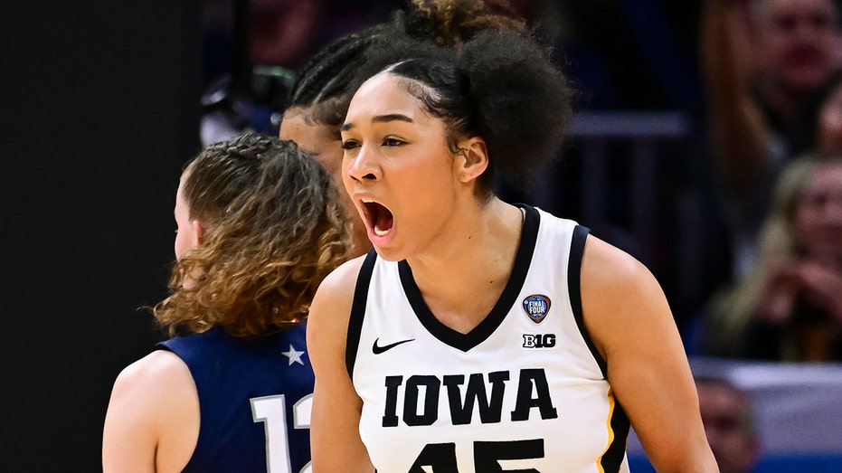 Iowa survives UConn’s late-game push to reach NCAA title game